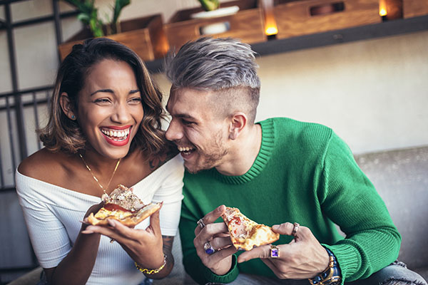 couple laughing and eating